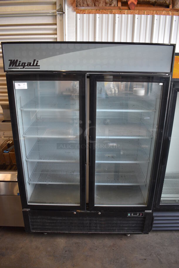 2016 Migali Model C-49FM Metal Commercial 2 Door Reach In Cooler Merchandiser w/ Poly Coated Racks on Commercial Casters. 115 Volts, 1 Phase. 52x32x81. Cannot Test Due To Cut Power Cord