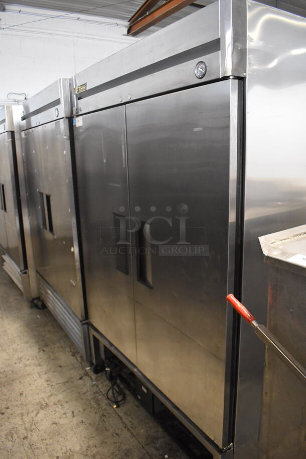 2013 True T-49F Commercial Stainless Steel Two Section Reach In Freezer With Polycoated Racks on Commercial Casters. 115V/1 Phase Tested And Working