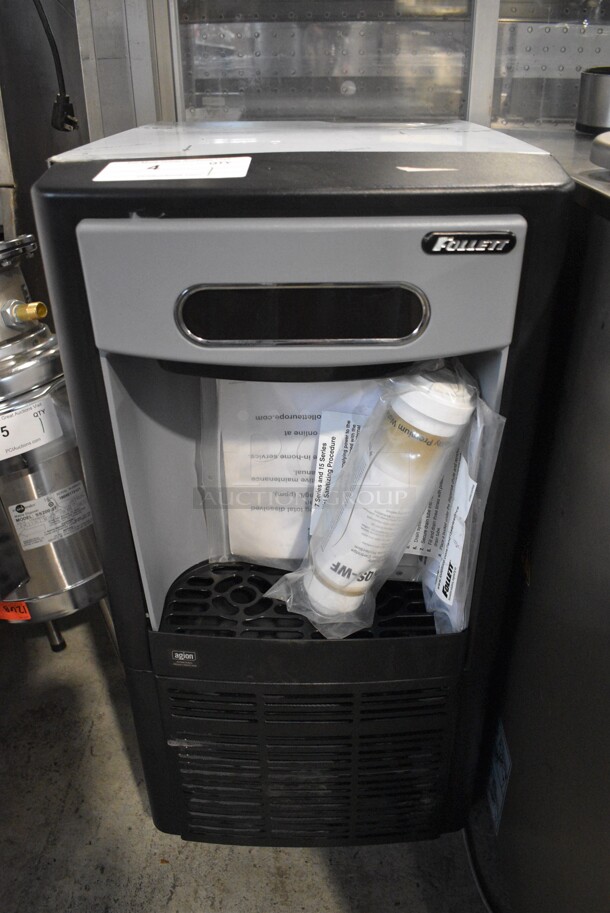 BRAND NEW SCRATCH AND DENT! 2018 Follett Model 7UD100A Metal Commercial Undercounter Ice Machine on Commercial Casters. 115 Volts, 1 Phase. 15x22x32