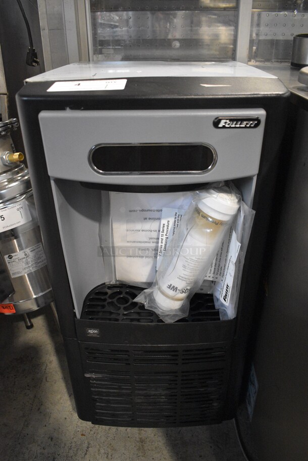 BRAND NEW SCRATCH AND DENT! 2018 Follett Model 7UD100A Metal Commercial Undercounter Ice Machine on Commercial Casters. 115 Volts, 1 Phase. 15x22x32 - Image 1 of 5