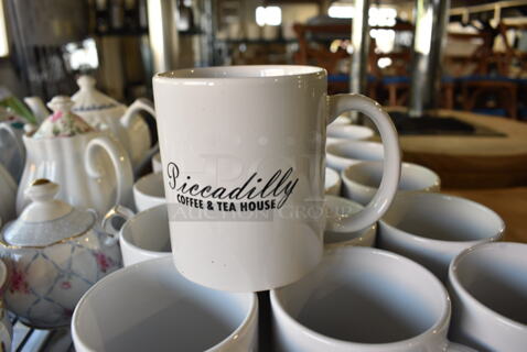 21 White Ceramic Mugs. 5x3.5x4. 21 Times Your Bid!