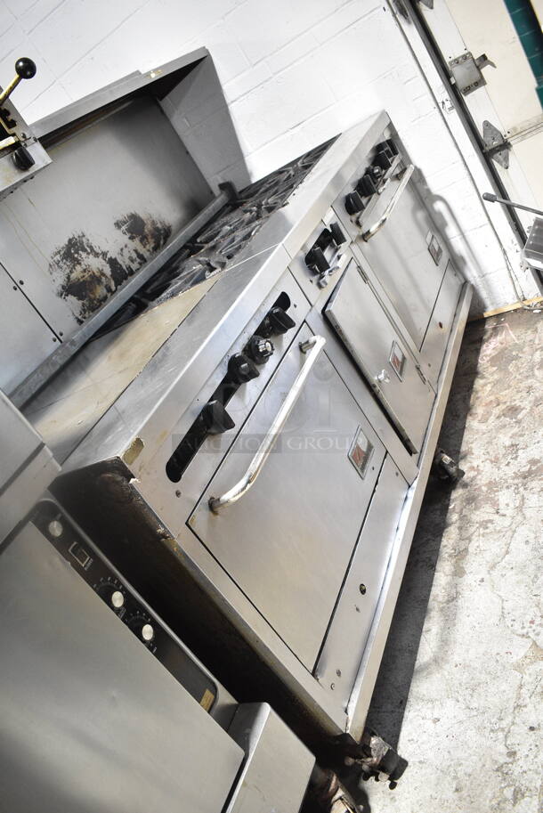 Southbend Stainless Steel Commercial Natural Gas Powered 6 Burner Range w/ Flat Top Griddle, 2 Ovens, Cheese Melter and Back Splash on Commercial Casters.  - Image 2 of 9