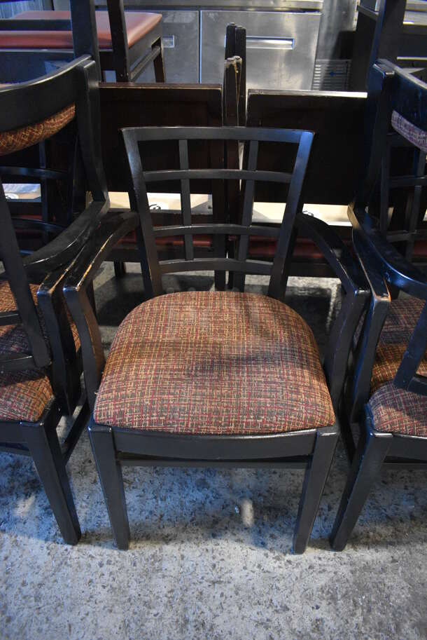 4 Black Wood Pattern Dining Chairs w/ Patterned Seat Cushion and Arm 
Rests. 20x18x33. 4 Times Your Bid!