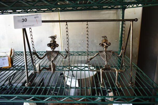 Metal Countertop Decoration of Swinging Monkeys.