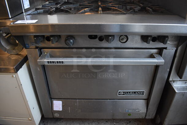 Garland Model M43R Stainless Steel Commercial Natural Gas Powered 6 Burner Range w/ Oven and Backsplash on Commercial Casters. 34x38x51.5 - Image 2 of 7
