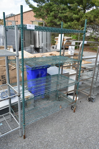 Green Finish Metal 4 Tier Shelving Unit. BUYER MUST DISMANTLE. PCI CANNOT DISMANTLE FOR SHIPPING. PLEASE CONSIDER FREIGHT CHARGES.