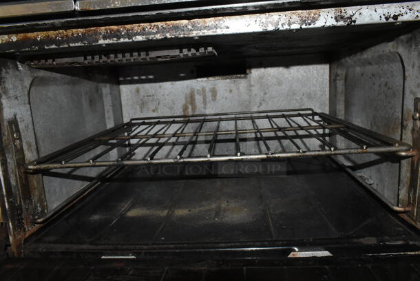 Garland SunFire X36-6R Stainless Steel Commercial Natural Gas Powered 6 Burner Range w/ Oven and Back Splash. - Image 6 of 8