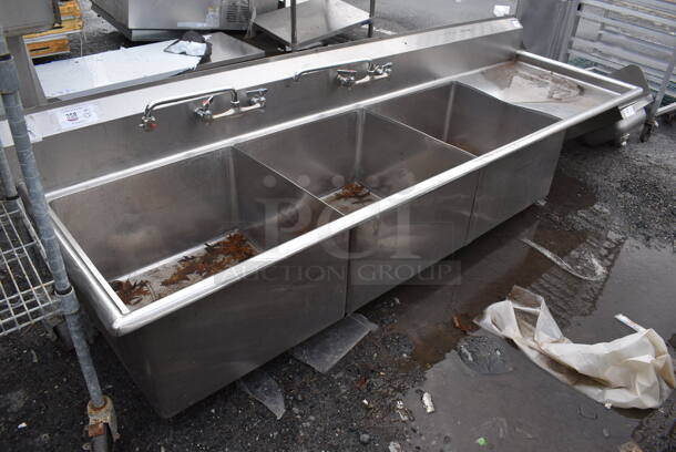Stainless Steel Commercial 3 Bay Sink w/ 2 Faucets, 2 Handle Sets and Right Side Drain Board. No Legs. 99x30x25. Bays 24x24x13. Drain Board 22x26x1