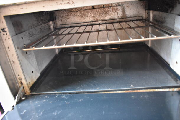 Wolf Stainless Steel Commercial Natural Gas Powered 6 Burner Range w/ Oven, Back Splash and Over Shelf on Commercial Casters.  - Image 8 of 12