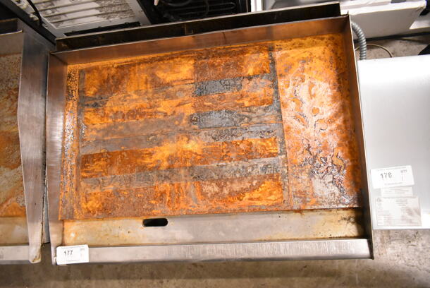 APW Wyott Stainless Steel Commercial Countertop Natural Gas Powered Flat Top Griddle.  - Image 3 of 4