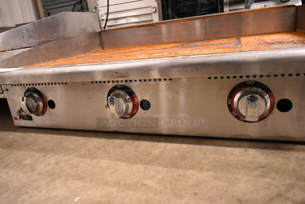 APW Wyott Stainless Steel Commercial Countertop Natural Gas Powered Flat Top Griddle.  - Image 4 of 4