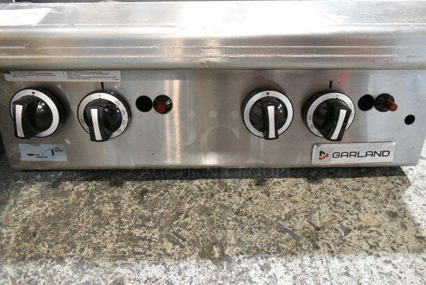 BRAND NEW SCRATCH AND DENT! 2024 Garland GTGG24-GT24M 24" Natural Gas Countertop Griddle with Thermostatic Controls.  - Image 8 of 10