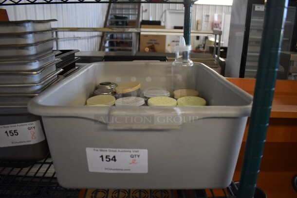 ALL ONE MONEY! Lot of Various Poly and Metal Shakers, Replacement Lids and Poly Oil Container in Gray Poly Bus Bin. Includes 4x3x4. - Image 5 of 5