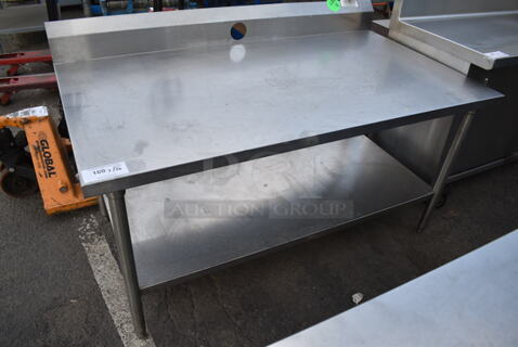 Stainless Steel Table w/ Back Splash and Under Shelf. 
