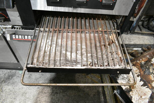Garland Metal Commercial Natural Gas Powered 6 Burner Range w/ Flat Top Griddle, 2 Ovens, Back Splash and Over Shelf on Commercial Casters.  - Image 8 of 11