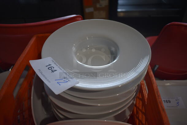 12 White Ceramic Plates. 10x10x2. 12 Times Your Bid!