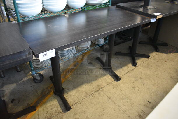 Dark Gray Wood Pattern Dining Table on 2 Black Metal Straight Leg Table Bases. Stock Picture - Cosmetic Condition May Vary. 48x24x29.5