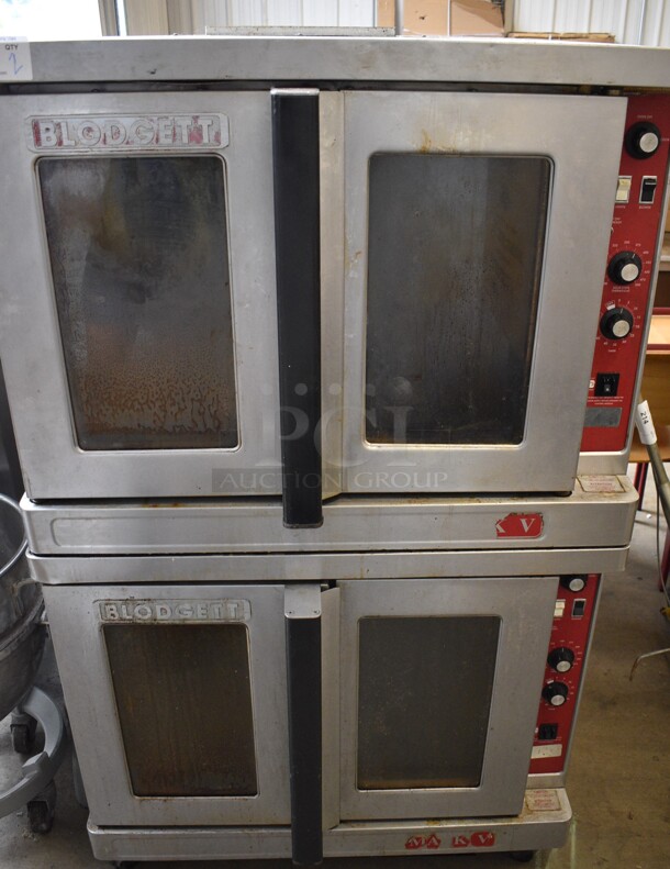 2 Blodgett Mark V Stainless Steel Commercial Electric Powered Full Size Convection Oven w/ View Through Doors, Metal Oven Racks and Thermostatic Controls. Appears To Be 208-240 Volts, 3 Phase. 2 Times Your Bid!