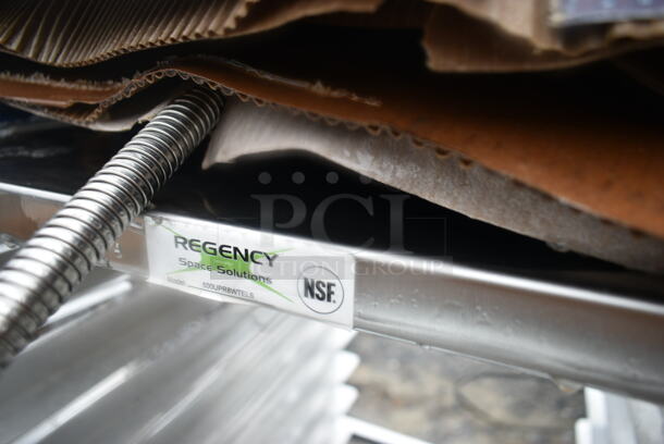 BRAND NEW SCRATCH AND DENT! Regency 600UPR8WTELS 8 Pan End Load Aluminum Undercounter Bun / Sheet Pan Rack with Stainless Steel Top and Side Channel - Image 7 of 7