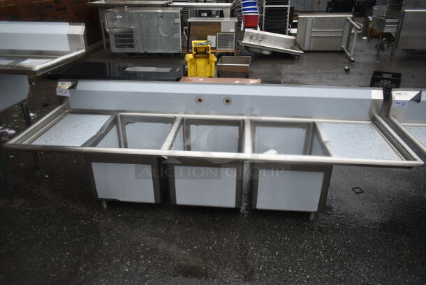BRAND NEW SCRATCH AND DENT! Regency 600S31824218 Stainless Steel Commercial 3 Bay Sink w/ Dual Drain Boards. Bays 18x24. Drain Boards 16x25 - Image 1 of 5