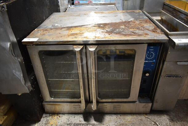 Stainless Steel Commercial Full Size Natural Gas Powered Convection Oven w/ View Through Doors, Metal Oven Racks and Thermostatic Controls.  - Image 1 of 5