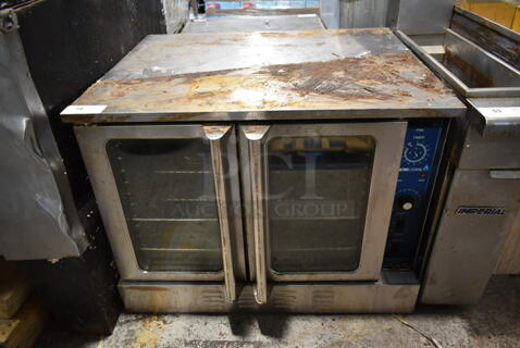 Stainless Steel Commercial Full Size Natural Gas Powered Convection Oven w/ View Through Doors, Metal Oven Racks and Thermostatic Controls. 