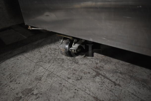 2012 True TG2R-2S ENERGY STAR Stainless Steel Commercial 2 Door Reach In Cooler w/ Poly Coated Racks on Commercial Casters. 115 Volts, 1 Phase. Tested and Working! - Image 4 of 7