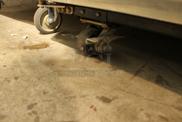 2012 True TG2R-2S ENERGY STAR Stainless Steel Commercial 2 Door Reach In Cooler w/ Poly Coated Racks on Commercial Casters. 115 Volts, 1 Phase. Tested and Working! - Image 4 of 7