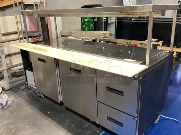 Randell Stainless Steel Dual-Sided Refridgerated Work Island, Multi-Pan Prep Table W/Two -Door and Two Drawers  Refrigerated Storage. Tested And Working. 84 x  46/52 x 58.
 - Image 9 of 11