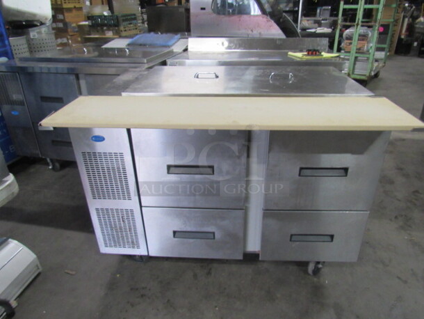 One Randell 4 Drawer Refrigerated Prep Table With Cutting Board On Casters. 115 Volt. Model# 9030K-7. 48X33X38. $6081.00.