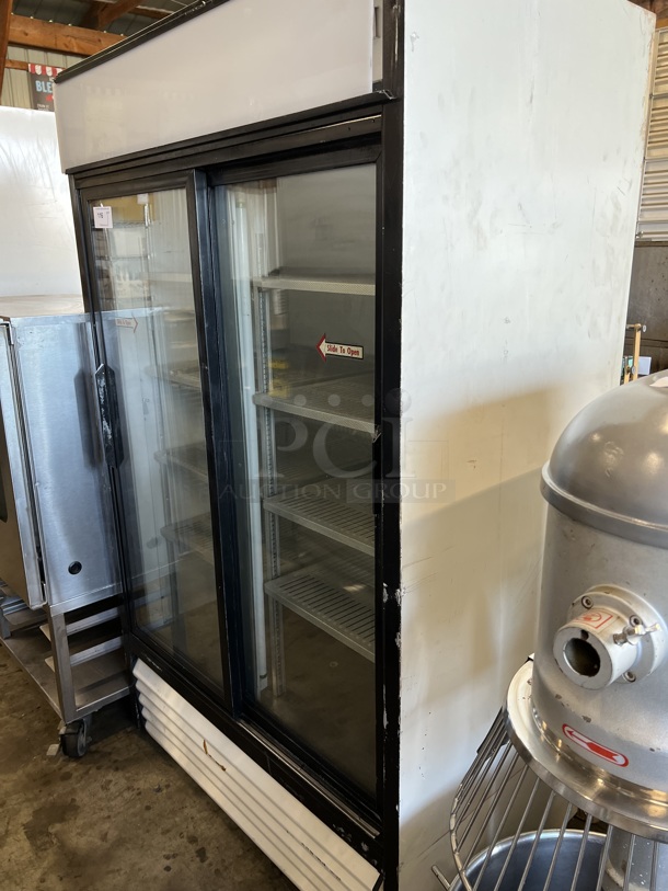 True Model GDM41 PE5712 Metal Commercial 2 Door Reach In Cooler Merchandiser w/ Racks. 115 Volts, 1 Phase. 47x29x79. Tested and Powers On But Does Not Get Cold