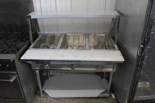 BRAND NEW SCRATCH AND DENT! 2022 ServIt 423EST3WO Stainless Steel Commercial Electric Powered Three Pan Open Well Steam Table with Angled Sneeze Guard and Casters. 120 Volts, 1 Phase. Tested and Working!