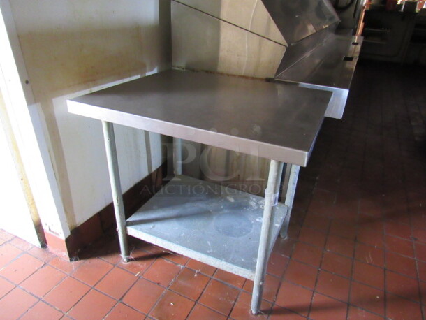 One Stainless Steel Table With Under Shelf. 36X30X35. BUYER MUST REMOVE!