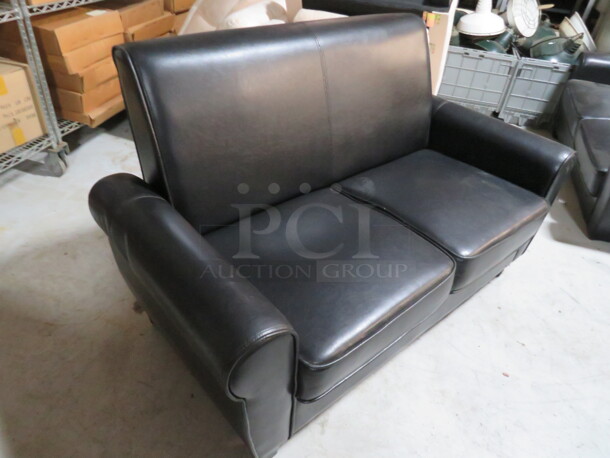 One Black Pleather Couch. Small Rip See Pic. 60X31X35 - Image 1 of 3