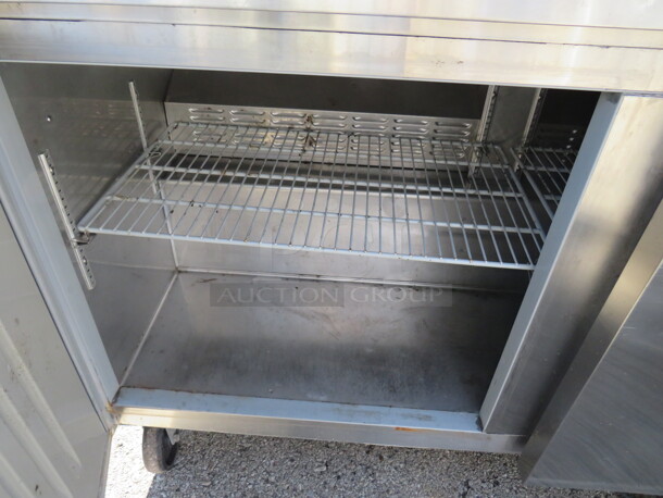 One WORKING Stainless 2 Door Hoshizaki Worktop Refrigerator, With 2 Racks,  On Casters. Model# CRMR60. 115 Volt. 60X30X36. $6750.00 - Image 2 of 2