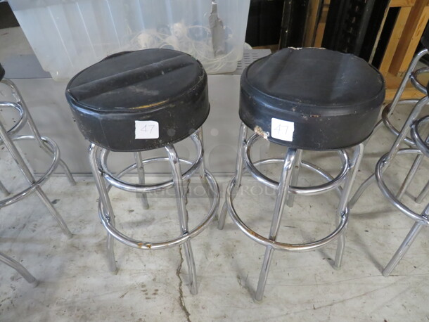 Double Chrome Ring Bar Stool With A Black Cushioned Swivel Seat. Need To Be Recovered. 2XBID - Image 1 of 1