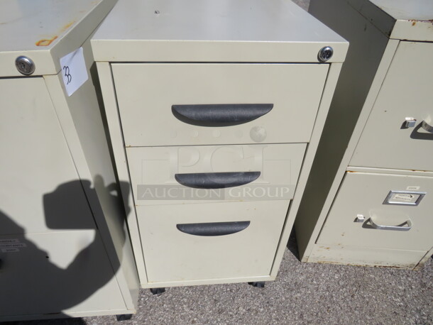 One 3 Drawer Metal File Cabinet On Casters. 15X23X28.