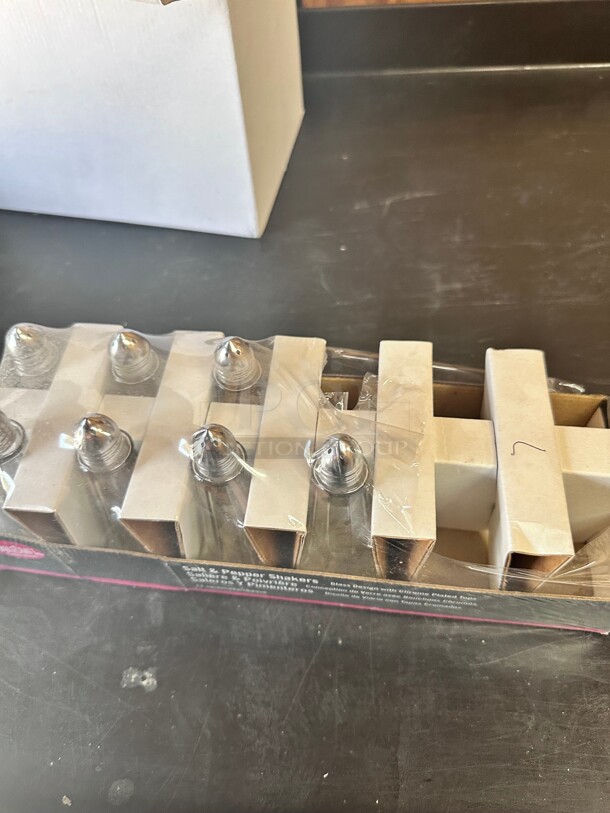 New! Tablecraft 83S&P 1 Ounce 4.38 inch x 1.88 inch Clear Glass Eiffel Tower Salt and Pepper Shakers with Nickel Plated Tops NSF  - Image 1 of 4