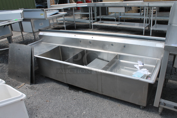 Stainless Steel Commercial 3 Bay Sink w/ Left Side Drain Board. No Legs. Bays 23x23. Drain Board 22x26.  - Image 1 of 11