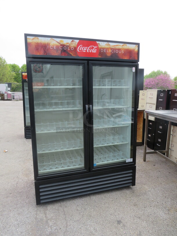 One WORKING True 2 Door Refrigerated Glass Display Merchandiser With 10 Racks And Soda Racking. Model# GDM-49-HC-TSL01. 115 Volt. 54X29.5X79.5