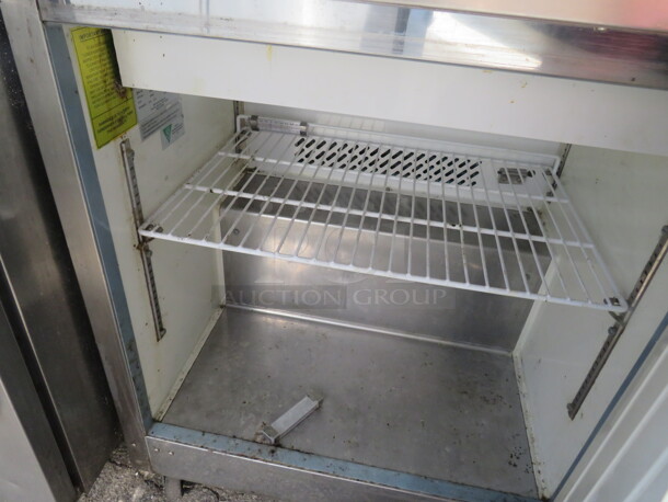 One Serv Ware 1 Door Refrigerated Prep Table With 1 Rack On Casters. Working NOT Cold. Model# SP29-12M. 115 Volt. 29X34X44.  - Image 2 of 2