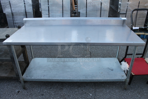 Stainless Steel Table w/ Back Splash and Under Shelf.