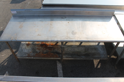 Stainless Steel Commercial Table w/ Back Splash and Under Shelf.