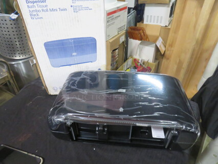 One NEW Tork Toilet Paper Dispenser.