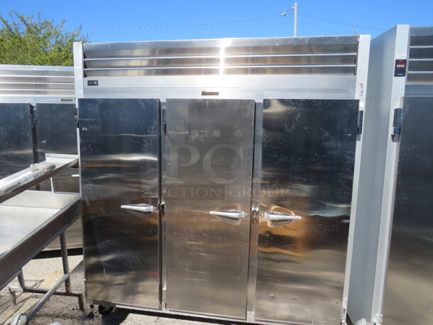 One WORKING AWESOME 3 Door Traulsen Stainless Steel  Refrigerator With 9 Racks, On Casters. 115 Volt. Model# G30011. 77X35X83.5. $9176.00