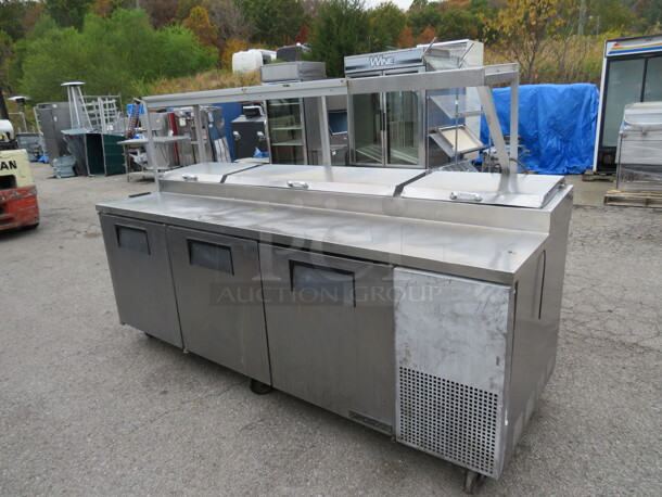 One True 3 Door Prep Table With Over shelf And 2 Ticket Rails, 2 Racks, On Casters. Model# TPP-93. 115 Volt. 93X33X59.5. Not Working - Image 1 of 4