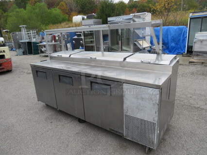 One True 3 Door Prep Table With Over shelf And 2 Ticket Rails, 2 Racks, On Casters. Model# TPP-93. 115 Volt. 93X33X59.5. Not Working