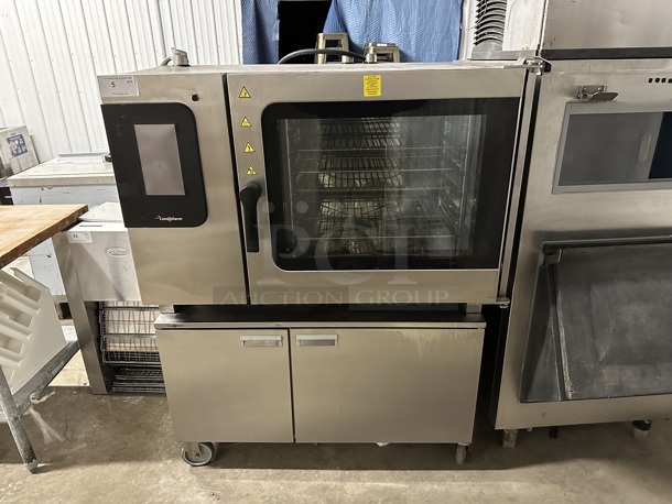 2021 Convotherm C4eT 6.20 EB Convotherm Stainless Steel Commercial Electric Powered Combi Convection Oven on 2 Door Equipment Stand w/ Commercial Casters. 208/240 Volts, 3 Phase.