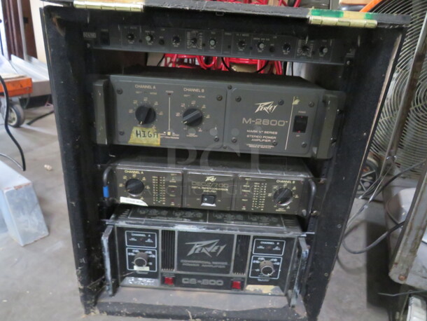 One Media Box WIth 1 Peavey M2600 Mark V Series Power Amplifier., 1 Peavey Deca/700 Digital Energy  Amplifier, 1 Peavey CS-800 Commercial Series Power Amplifier, And 1 Rane AC22 Active Crossover. - Image 1 of 3