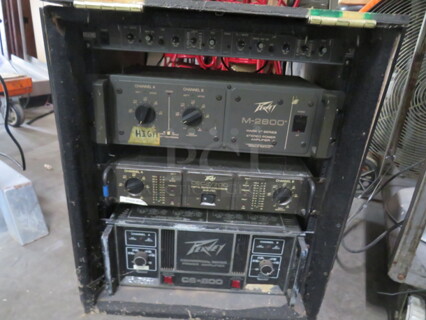 One Media Box WIth 1 Peavey M2600 Mark V Series Power Amplifier., 1 Peavey Deca/700 Digital Energy  Amplifier, 1 Peavey CS-800 Commercial Series Power Amplifier, And 1 Rane AC22 Active Crossover.